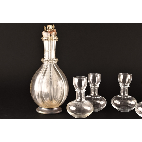 229 - A quadruple glass decanter by Humphrey Taylor of London with individual compartments for curaçao, pe... 