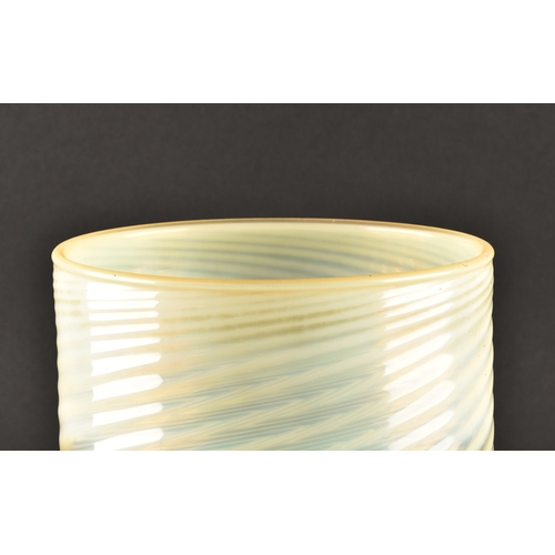 231 - A large opalescent pale green glass light shade, with swirled and ribbed detail, 22 cm high x 18.5 c... 