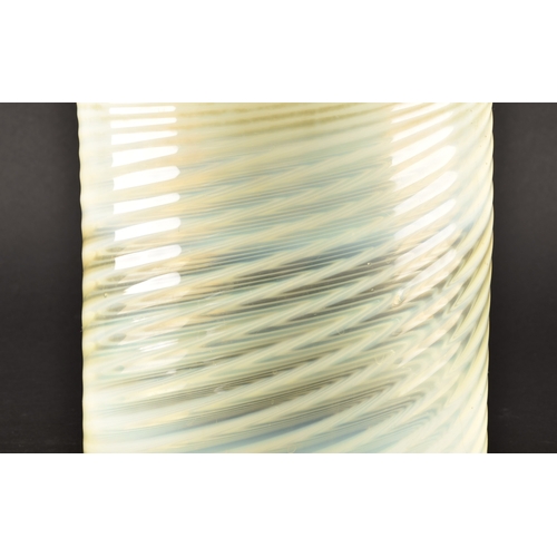 231 - A large opalescent pale green glass light shade, with swirled and ribbed detail, 22 cm high x 18.5 c... 