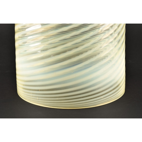 231 - A large opalescent pale green glass light shade, with swirled and ribbed detail, 22 cm high x 18.5 c... 