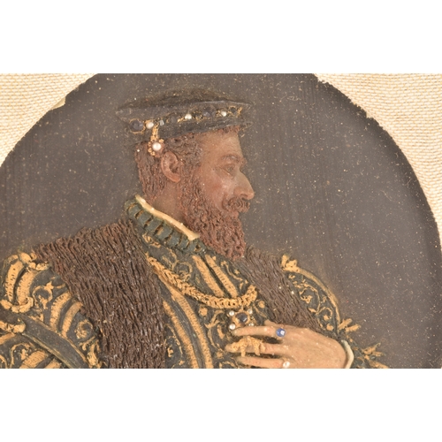 258 - An early 20th century carved and painted wax portrait of a Tudor nobleman, in richly decorated robes... 