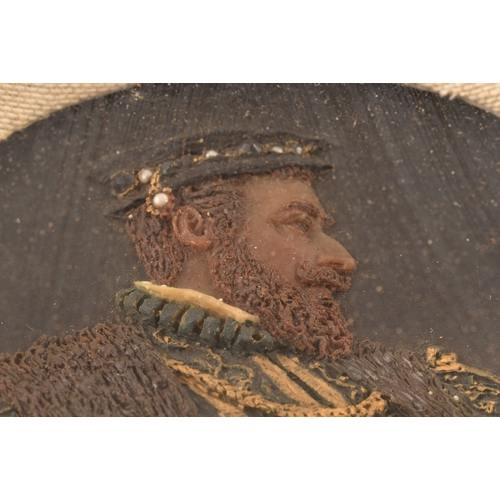 258 - An early 20th century carved and painted wax portrait of a Tudor nobleman, in richly decorated robes... 