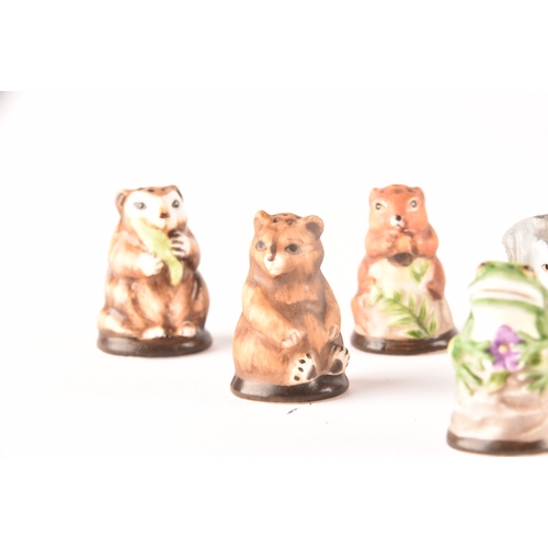 263 - A collection of 'Friends of the Forest' thimbles, including fifteen animal thimbles, accompanied by ... 