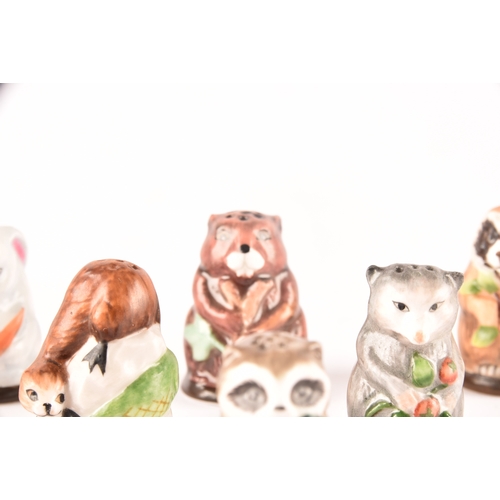 263 - A collection of 'Friends of the Forest' thimbles, including fifteen animal thimbles, accompanied by ... 