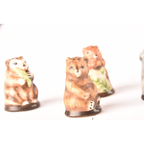 263 - A collection of 'Friends of the Forest' thimbles, including fifteen animal thimbles, accompanied by ... 