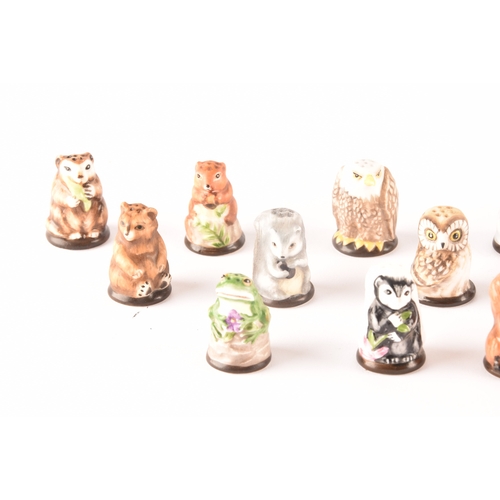 263 - A collection of 'Friends of the Forest' thimbles, including fifteen animal thimbles, accompanied by ... 