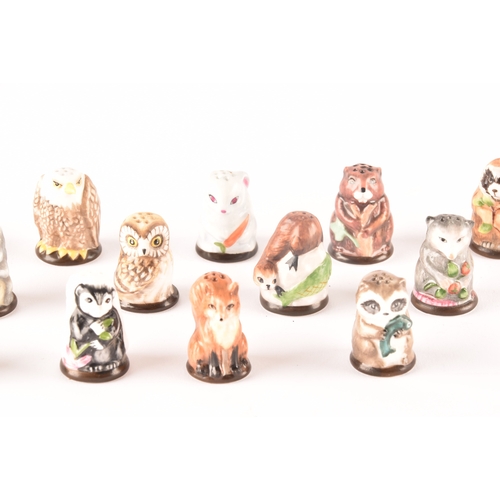 263 - A collection of 'Friends of the Forest' thimbles, including fifteen animal thimbles, accompanied by ... 