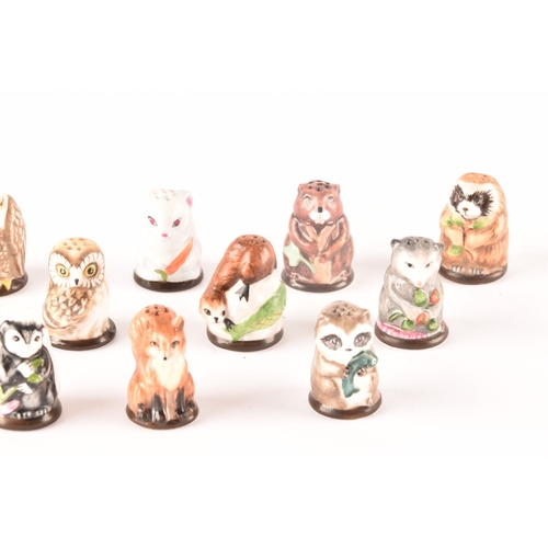 263 - A collection of 'Friends of the Forest' thimbles, including fifteen animal thimbles, accompanied by ... 