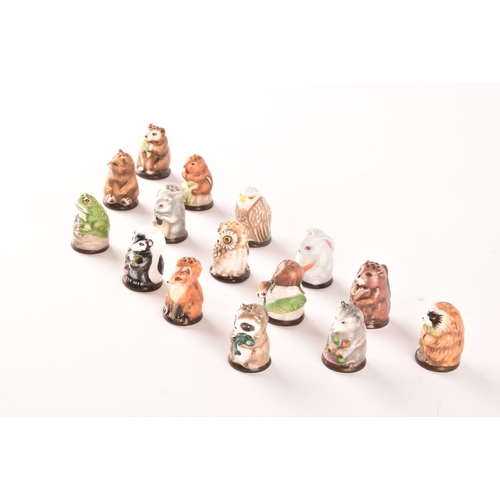 263 - A collection of 'Friends of the Forest' thimbles, including fifteen animal thimbles, accompanied by ... 