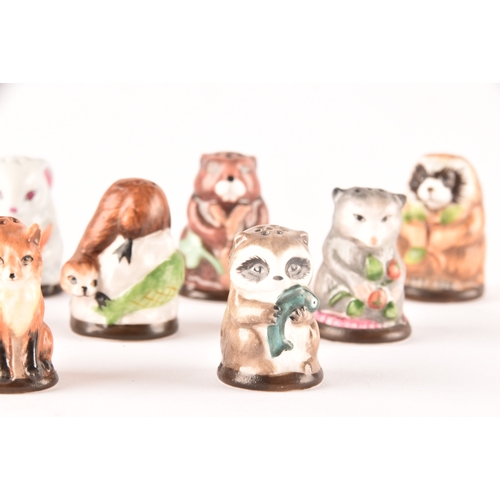 263 - A collection of 'Friends of the Forest' thimbles, including fifteen animal thimbles, accompanied by ... 