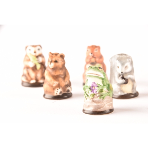 263 - A collection of 'Friends of the Forest' thimbles, including fifteen animal thimbles, accompanied by ... 