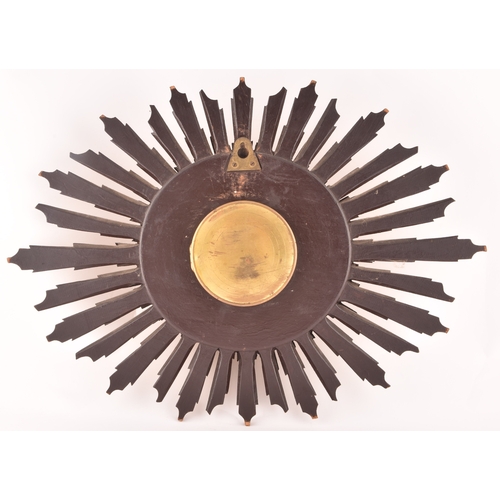 277 - An Art Deco starburst wall clock, with gold roman numeral dial, gilt wood, 55cm wide x 41 cm high.