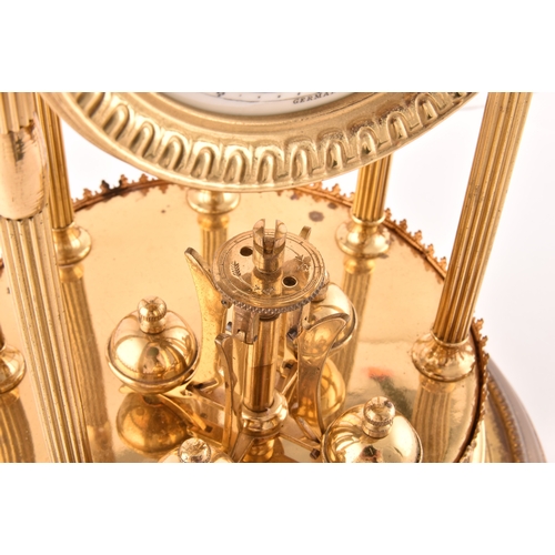 278 - A large German torsion clock timepiece, the cream dial painted with floral motif within a pagoda bra... 