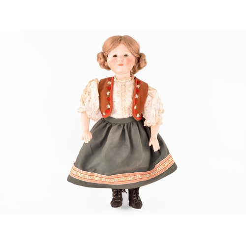 310 - A Kammer & Reinhardt German bisque doll in traditional dress, numbered 101, marked R198, 47 cm.