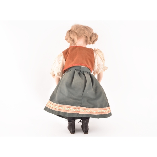 310 - A Kammer & Reinhardt German bisque doll in traditional dress, numbered 101, marked R198, 47 cm.