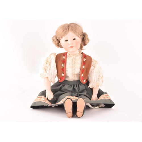 310 - A Kammer & Reinhardt German bisque doll in traditional dress, numbered 101, marked R198, 47 cm.