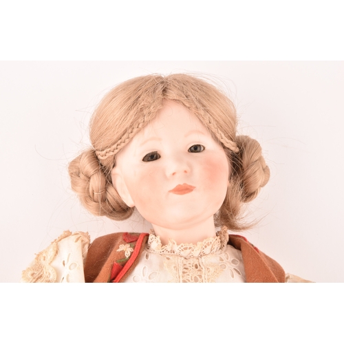 310 - A Kammer & Reinhardt German bisque doll in traditional dress, numbered 101, marked R198, 47 cm.