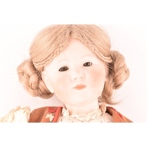 310 - A Kammer & Reinhardt German bisque doll in traditional dress, numbered 101, marked R198, 47 cm.