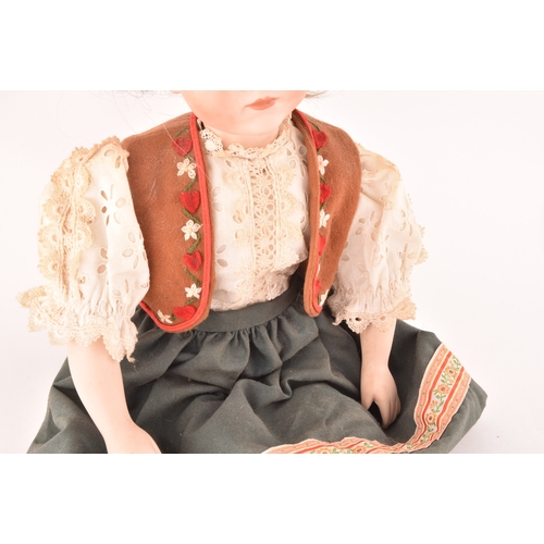 310 - A Kammer & Reinhardt German bisque doll in traditional dress, numbered 101, marked R198, 47 cm.