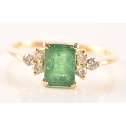 17 - An 18ct yellow gold ring, featuring an rectangular emerald with an approximate weight of 1.10 carats... 