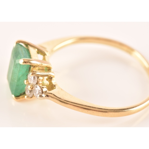 17 - An 18ct yellow gold ring, featuring an rectangular emerald with an approximate weight of 1.10 carats... 