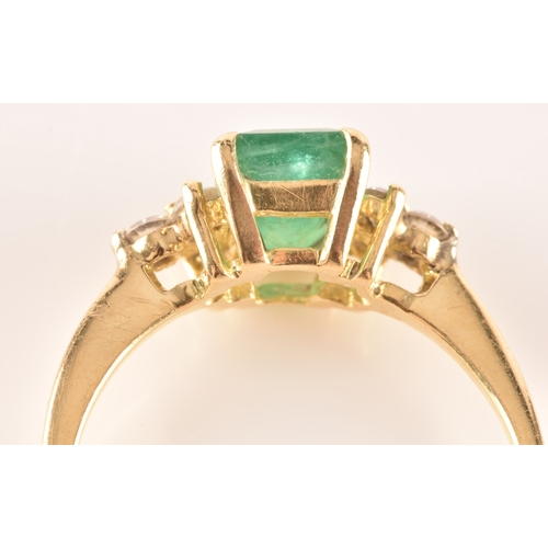 17 - An 18ct yellow gold ring, featuring an rectangular emerald with an approximate weight of 1.10 carats... 