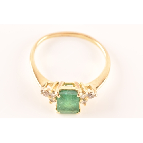 17 - An 18ct yellow gold ring, featuring an rectangular emerald with an approximate weight of 1.10 carats... 