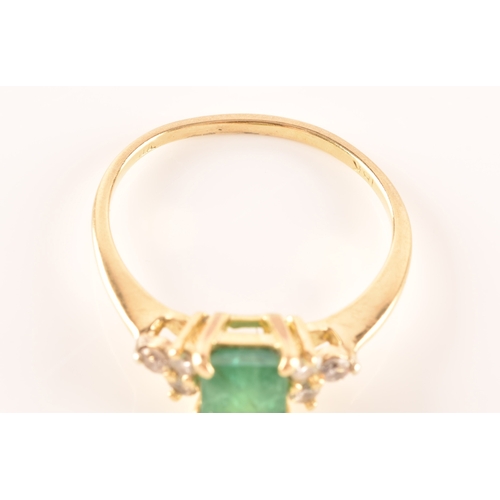 17 - An 18ct yellow gold ring, featuring an rectangular emerald with an approximate weight of 1.10 carats... 