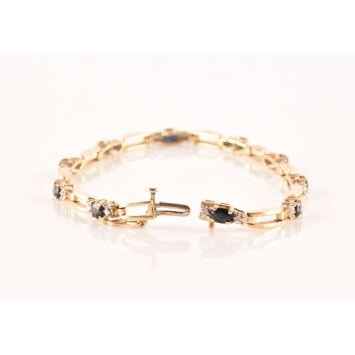 71 - A 14ct yellow gold sapphire and diamond line bracelet, set with ten oval cut sapphires with an appro... 