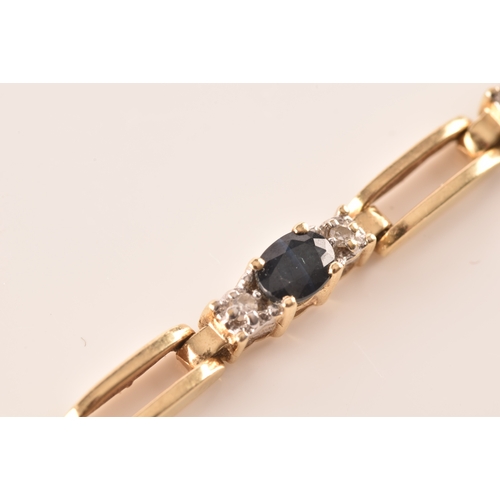 71 - A 14ct yellow gold sapphire and diamond line bracelet, set with ten oval cut sapphires with an appro... 