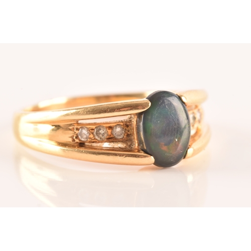 79 - A 18ct yellow gold ring, set to centre with a lightning ridge black opal doublet measuring L 8 x W 5... 