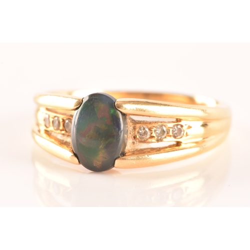 79 - A 18ct yellow gold ring, set to centre with a lightning ridge black opal doublet measuring L 8 x W 5... 