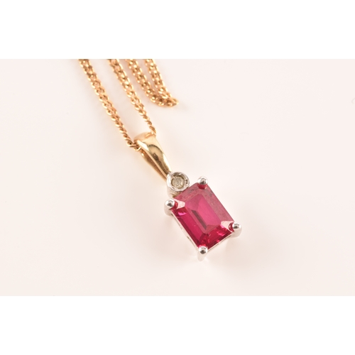 24 - A 9ct yellow gold and white metal synthetic ruby pendant set with a rectangular ruby with an approxi... 