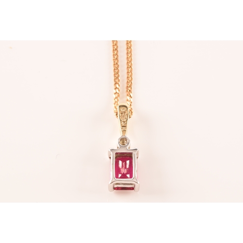 24 - A 9ct yellow gold and white metal synthetic ruby pendant set with a rectangular ruby with an approxi... 