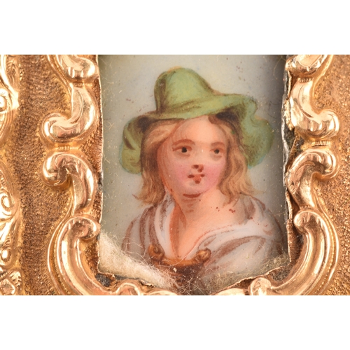 26 - A 19th century brooch, featuring a miniature enamel portrait of a lady surrounded by an ornate yello... 