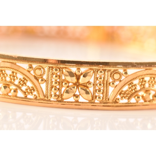 2 - A 22ct yellow gold bangle, with ornate filigree detail, marked 'SIR22K', 6cm diameter.