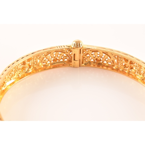 2 - A 22ct yellow gold bangle, with ornate filigree detail, marked 'SIR22K', 6cm diameter.