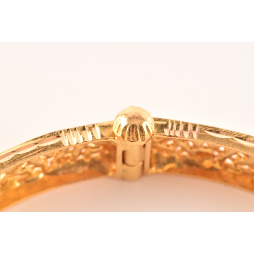 2 - A 22ct yellow gold bangle, with ornate filigree detail, marked 'SIR22K', 6cm diameter.