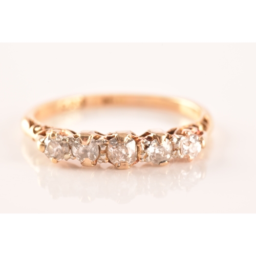 29 - A five stone 18ct yellow gold, set with five old mine diamonds with a combined approximate weight of... 