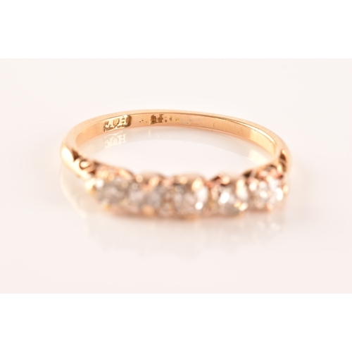 29 - A five stone 18ct yellow gold, set with five old mine diamonds with a combined approximate weight of... 