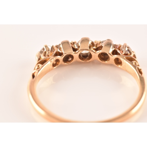 29 - A five stone 18ct yellow gold, set with five old mine diamonds with a combined approximate weight of... 