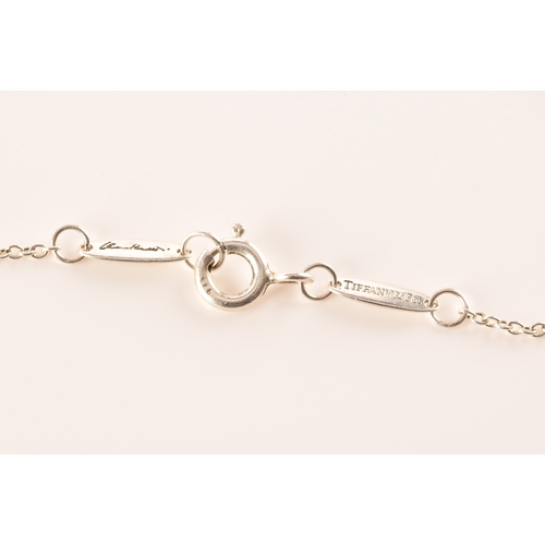 31 - Tiffany & Co. A group of Perreti design jewellery, to include a silver teardrop bean chain brace... 