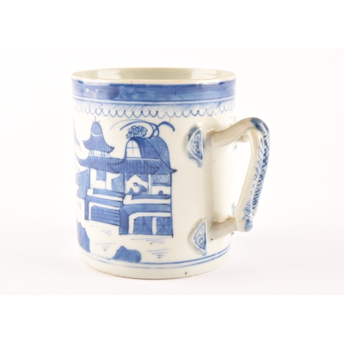 216 - A 19th century Chinese blue and white porcelain tankard, decoration depicting a rural coastal villag... 