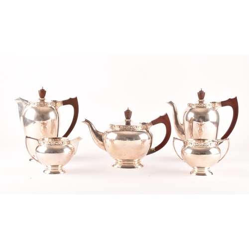 119 - A Elizabeth II five piece Garrard & Co silver tea and coffee set, including a tea pot, coffee po... 