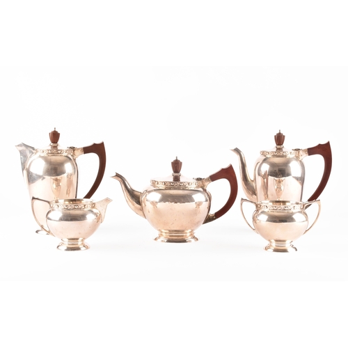 119 - A Elizabeth II five piece Garrard & Co silver tea and coffee set, including a tea pot, coffee po... 