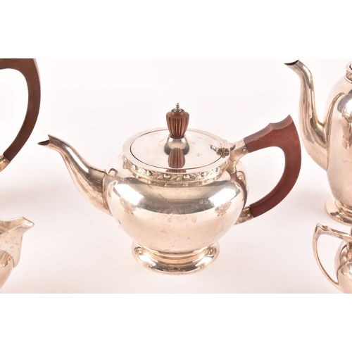 119 - A Elizabeth II five piece Garrard & Co silver tea and coffee set, including a tea pot, coffee po... 