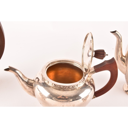 119 - A Elizabeth II five piece Garrard & Co silver tea and coffee set, including a tea pot, coffee po... 