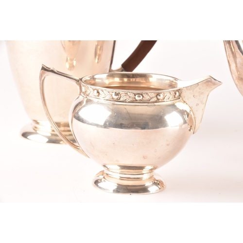 119 - A Elizabeth II five piece Garrard & Co silver tea and coffee set, including a tea pot, coffee po... 