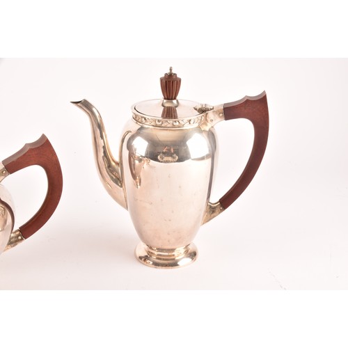 119 - A Elizabeth II five piece Garrard & Co silver tea and coffee set, including a tea pot, coffee po... 