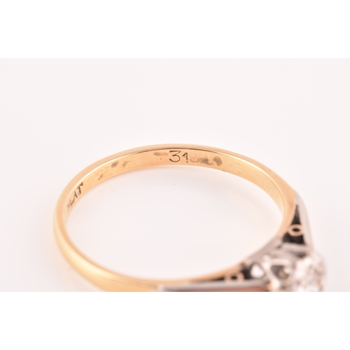 33 - A mid 20th century 18ct yellow gold and platinum solitaire ring, set to centre with a round brillian... 